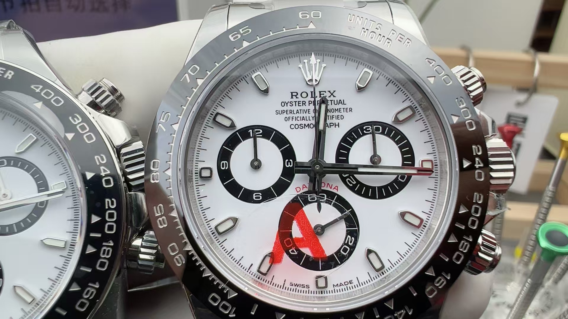 VSF Daytona white dial macro showing sub-dial rings hour markers and Swiss Made signature